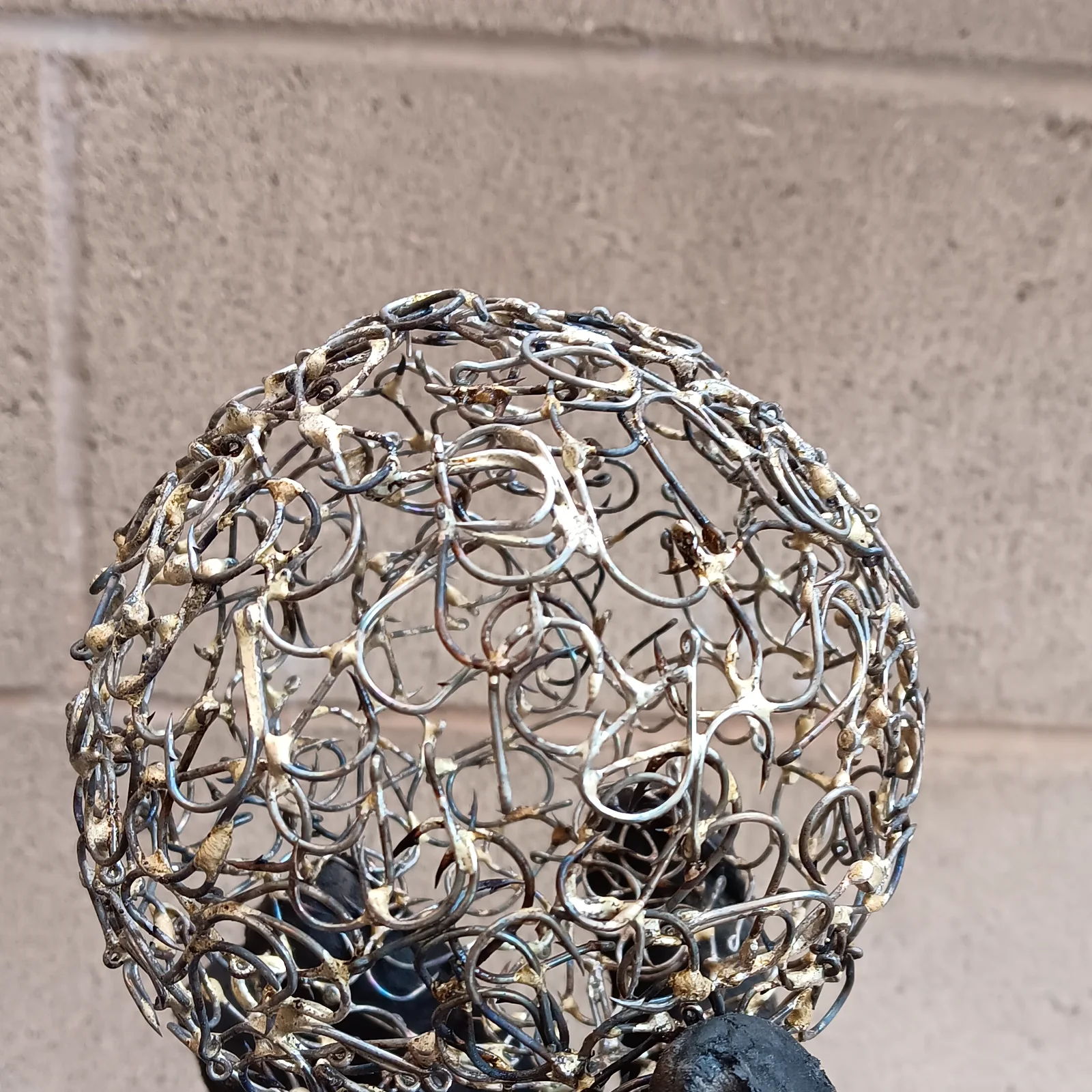 A sphere formed from small pieces of curved wire